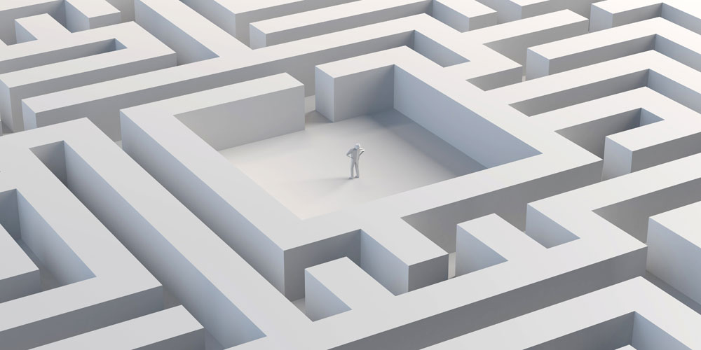 Person standing in the middle of a maze