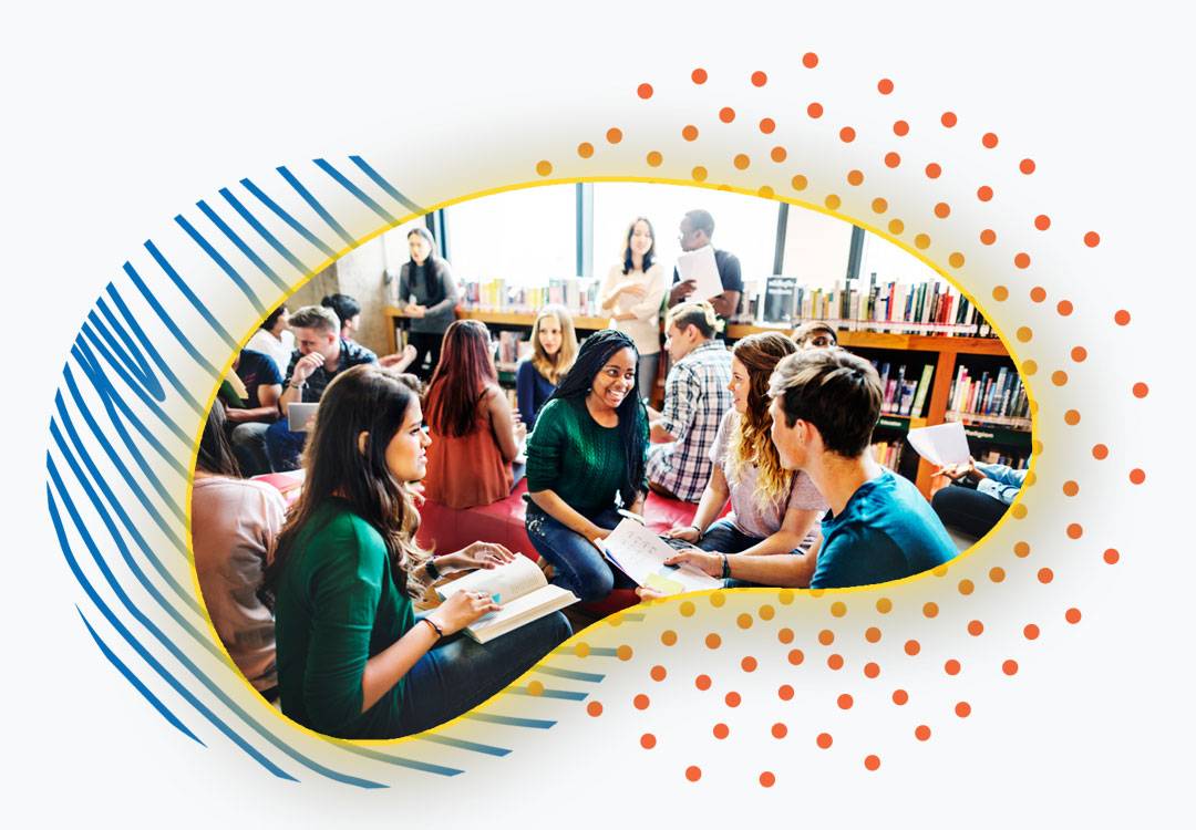 Group of students talking in a library